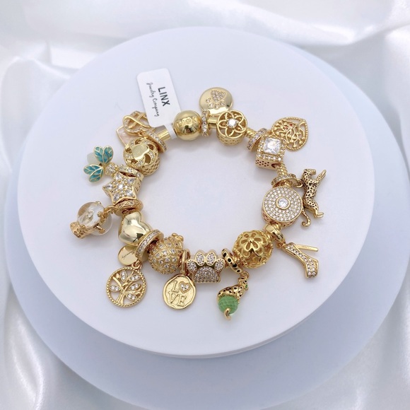 Linx Yellow Gold Bracelet with Gold and Green Themed Charms